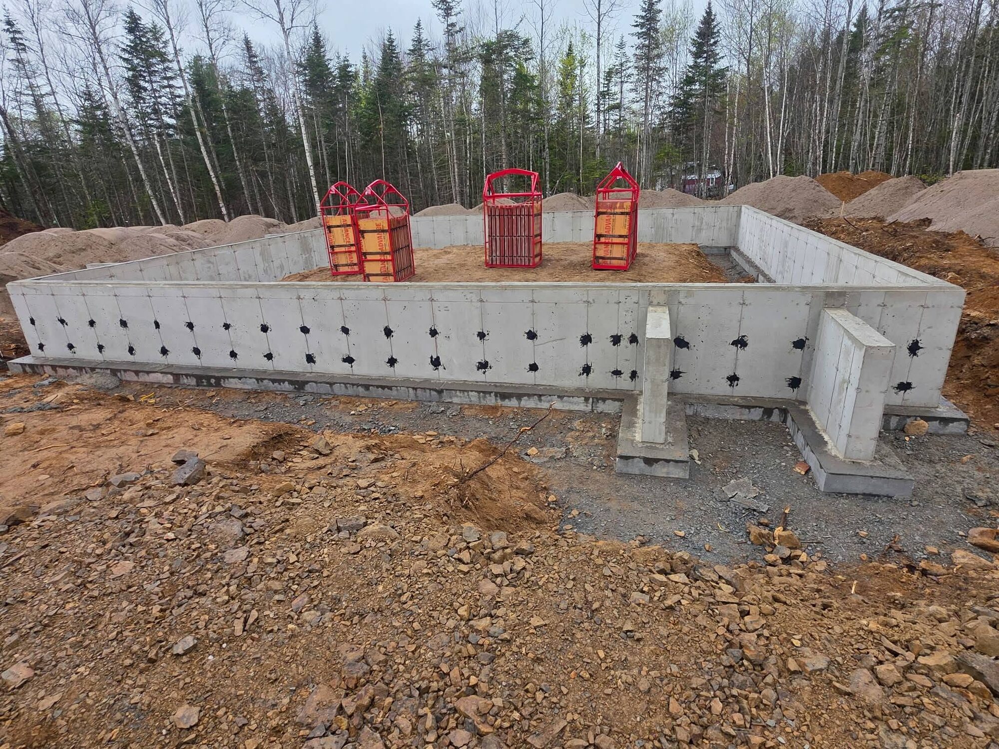 Footings, walls and slab for a spec house in the woods