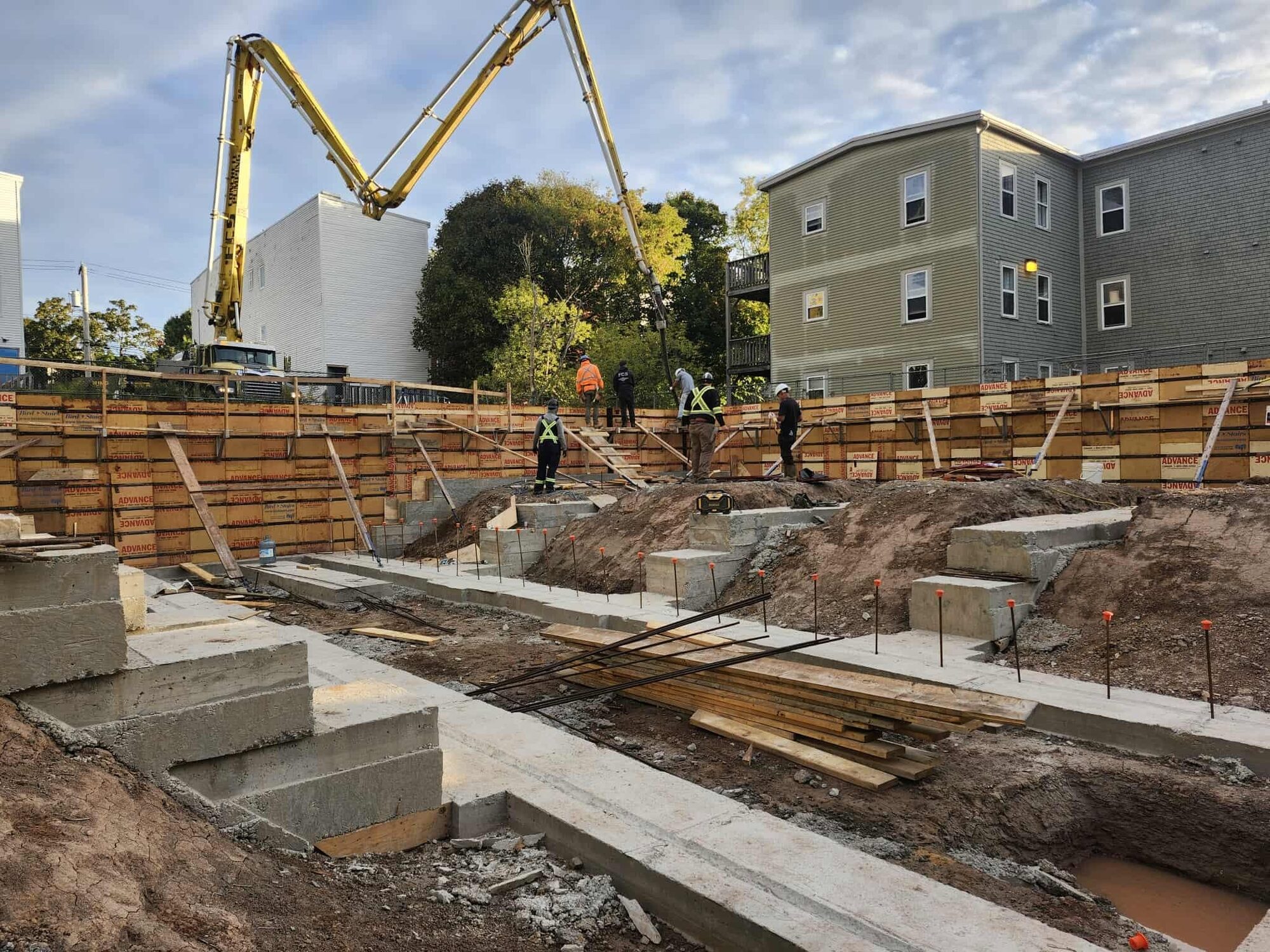 Footings and foundation walls for an 18-unit block